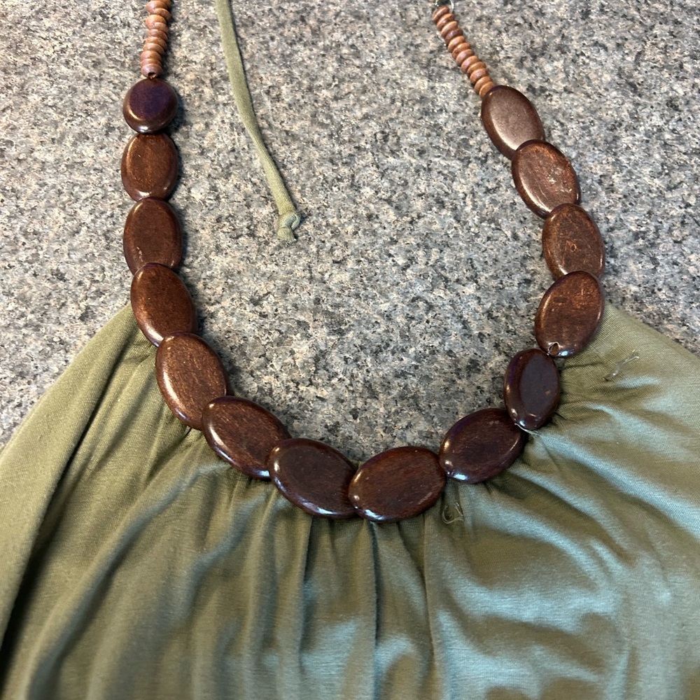 Dark green dress with wooden bead neckline